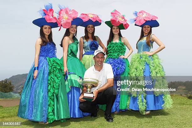 Ricardo Santos of Portugal celebrates winning the Madeira Islands Open with the trophy at Santo da Serra Golf Course on May 13, 2012 in Funchal,...