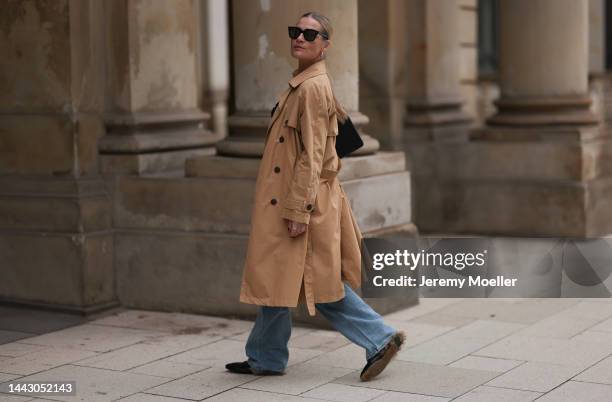 Julia Conrad seen wearing a black Julove Shirt, Zara brown coat, Gucci black loafer, black Chanel handbag,Frankie Shop blue jeans on November 18,...