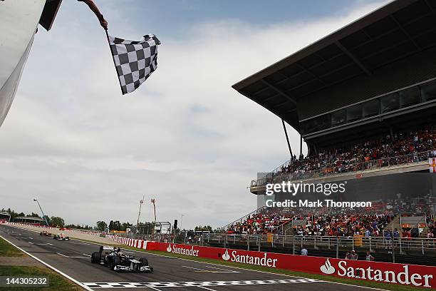 Pastor Maldonado of Venezuela and Williams crosses the finishing line to win the Spanish Formula One Grand Prix at the Circuit de Catalunya on May...
