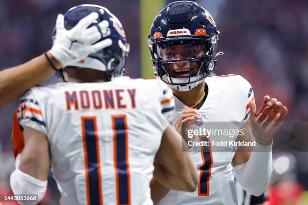 Darnell Mooney of the Chicago Bears and Justin Fields of the Chicago Bears celebrate after Mooney's touchdown catch during the first quarter against...