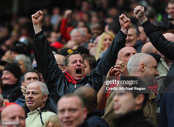 Manchester United fan reacts to hearing news of QPR scoring at Manchester City during the Barclays Premier League match between Sunderland and...