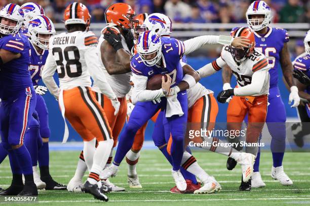Myles Garrett of the Cleveland Browns sacks Josh Allen of the Buffalo Bills during the first quarter at Ford Field on November 20, 2022 in Detroit,...