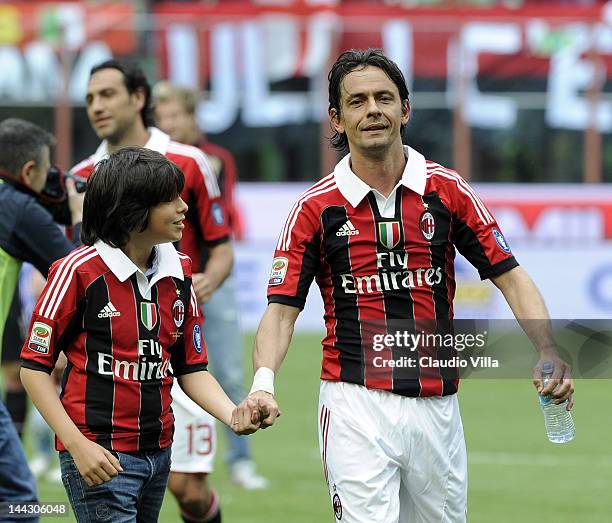 Filippo Inzaghi of AC Milan and his nephew Tommaso Inzaghi salute the audience after his last game for AC Milan during the Serie A match between AC...