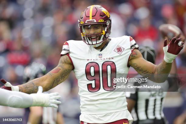 Montez Sweat of the Washington Commanders celebrates a sack in the second quarter of a game against the Houston Texans at NRG Stadium on November 20,...