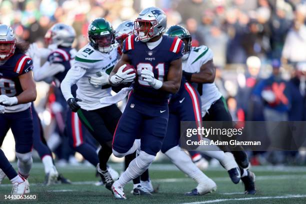 Jonnu Smith of the New England Patriots carries the ball against the New York Jets during the first quarter at Gillette Stadium on November 20, 2022...