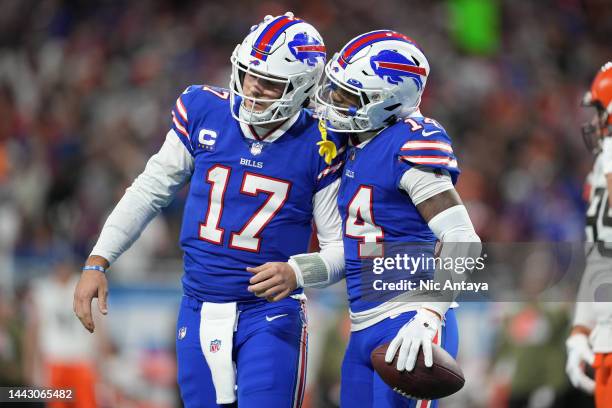 Josh Allen of the Buffalo Bills and Stefon Diggs of the Buffalo Bills celebrate after a touchdown during the second quarter against the Cleveland...