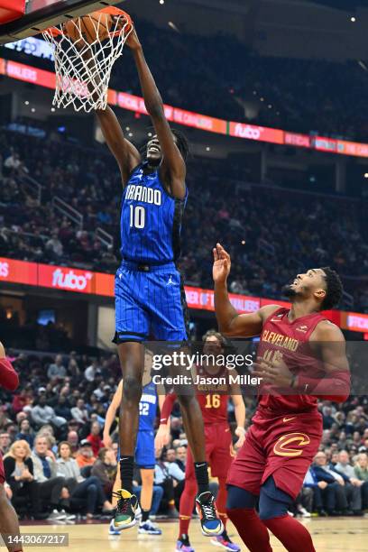 Bol Bol of the Orlando Magic dunks over Donovan Mitchell of the Cleveland Cavaliers during the first half at Rocket Mortgage Fieldhouse on October...