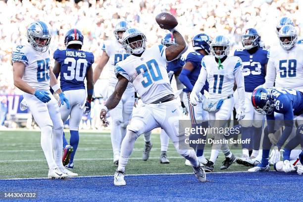 Jamaal Williams of the Detroit Lions celebrates after scoring a touchdown against the New York Giants during the second quarter at MetLife Stadium on...