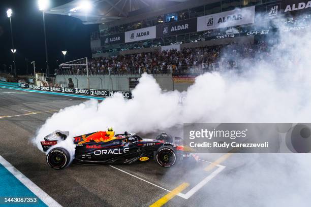 Third placed Sergio Perez of Mexico and Oracle Red Bull Racing performs a celebratory donut during the F1 Grand Prix of Abu Dhabi at Yas Marina...