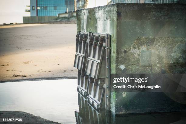 redcar beach sewage outlet - water pollution pipe stock pictures, royalty-free photos & images