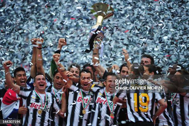 Juventus' forward Alessandro Del Piero holds the Italian Serie A trophy, the Scudetto, after their match against Atalanta on May 13, 2012 in Juventus...