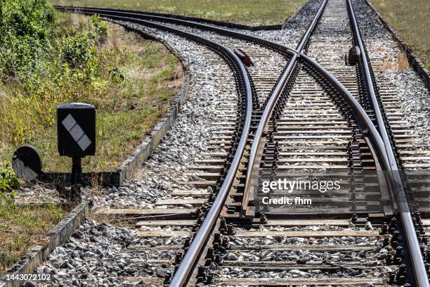 switch at a railroad track - weichen gleise stock-fotos und bilder