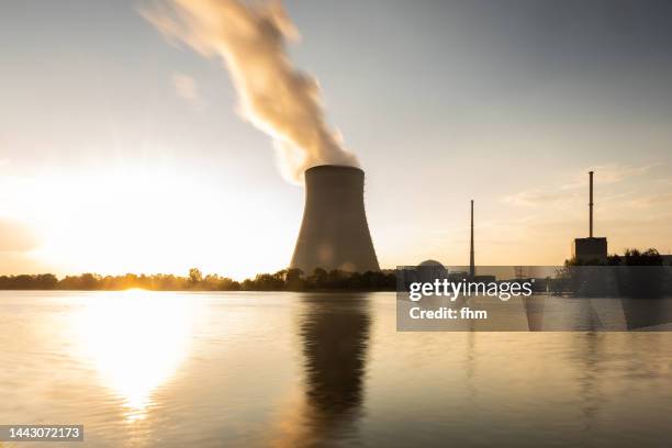 nuclear power plant at sunset (isar 2 - bavaria, germany) - nuclear energy stock-fotos und bilder