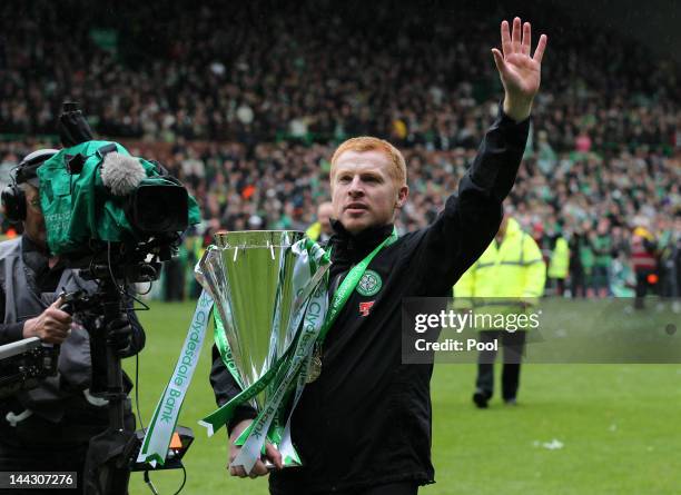 Neil Lennon coach of Celtic celebrates with the Clydesdale Bank Premier League trophy following the Clydesdale Bank Premier League match between...