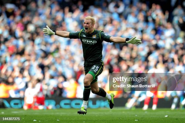 Goalkeeper Joe Hart of Manchester City celebrates winning the title as the final whistle blows during the Barclays Premier League match between...