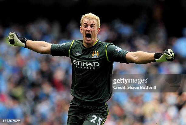 Goalkeeper Joe Hart of Manchester City celebrates winning the title as the final whistle blows during the Barclays Premier League match between...