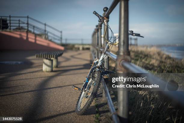 bike against railings atsaltburn by the sea in teeside - saltburn stock pictures, royalty-free photos & images