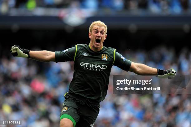 Goalkeeper Joe Hart of Manchester City celebrates winning the title as the final whistle blows during the Barclays Premier League match between...