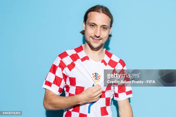 Lovro Majer of Croatia poses during the official FIFA World Cup Qatar 2022 portrait session on November 19, 2022 in Doha, Qatar.
