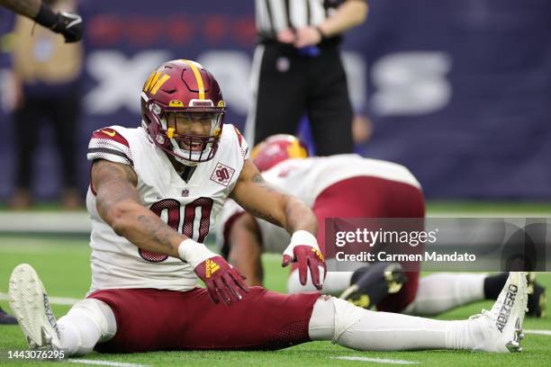 Montez Sweat of the Washington Commanders reacts after sacking Davis Mills of the Houston Texans in the third quarter at NRG Stadium on November 20,...