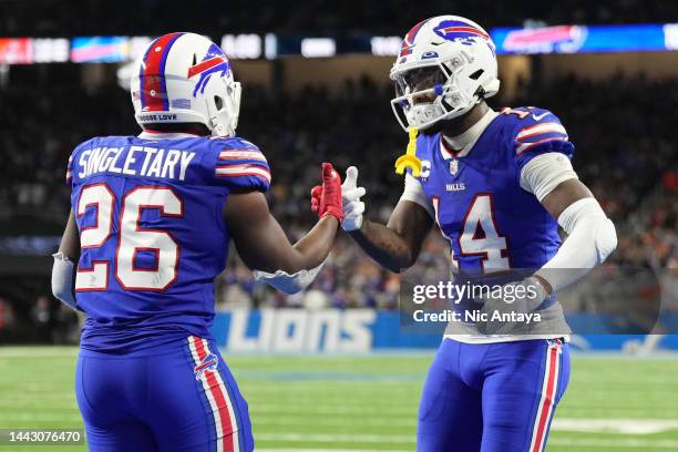 Devin Singletary of the Buffalo Bills celebrates with Stefon Diggs of the Buffalo Bills after Singletary's touchdown during the third quarter against...