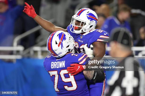 Spencer Brown of the Buffalo Bills celebrates with Devin Singletary of the Buffalo Bills after Singletary's touchdown during the third quarter...