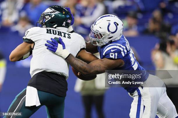 Jalen Hurts of the Philadelphia Eagles fumbles the ball after being hit by Yannick Ngakoue of the Indianapolis Colts during the third quarter during...