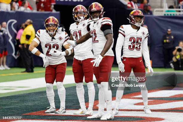 Darrick Forrest of the Washington Commanders celebrates an interception in the fourth quarter of a game against the Houston Texans at NRG Stadium on...