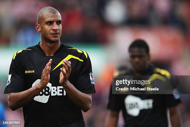 David N'Gog and Dedryck Boyata of Bolton Wanderers look dejected as they are relegated after the Barclays Premier League match between Stoke City and...