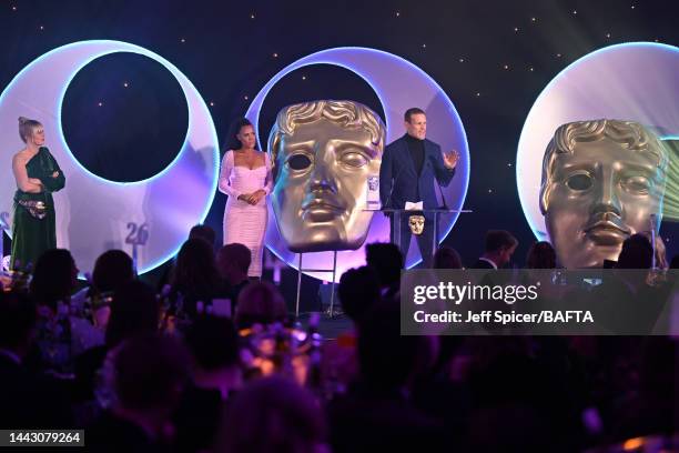 Edith Bowman and Jean Johansson look on as Sam Heughan, winner of the Audience Award in partnership with Screen Scotland for ‘Outlander’ celebrates...