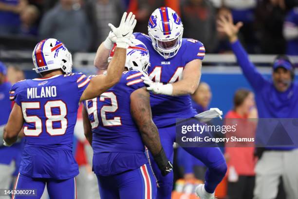 Matt Milano of the Buffalo Bills and Tyler Matakevich of the Buffalo Bills celebrate with DaQuan Jones of the Buffalo Bills after a blocked field...