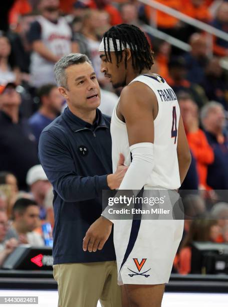 Head coach Tony Bennett of the Virginia Cavaliers talks with Armaan Franklin during a break against the Illinois Fighting Illini in the first half of...