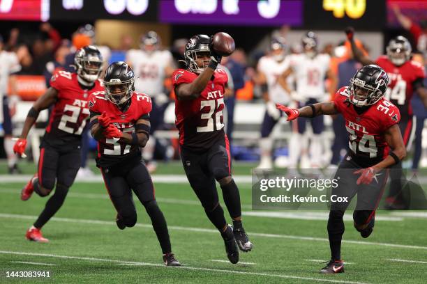 Dee Alford of the Atlanta Falcons, Jaylinn Hawkins of the Atlanta Falcons and Darren Hall of the Atlanta Falcons celebrate after Hawkins'...