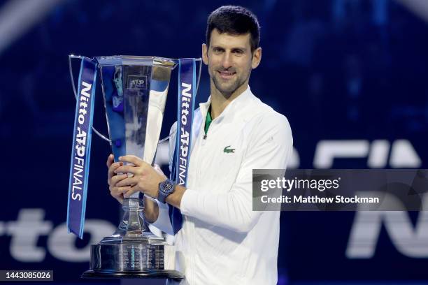 Novak Djokovic of Serbia poses with the trophy after defeating Casper Ruud of Norway during the Final on Day Eight of the Nitto ATP Finals at Pala...