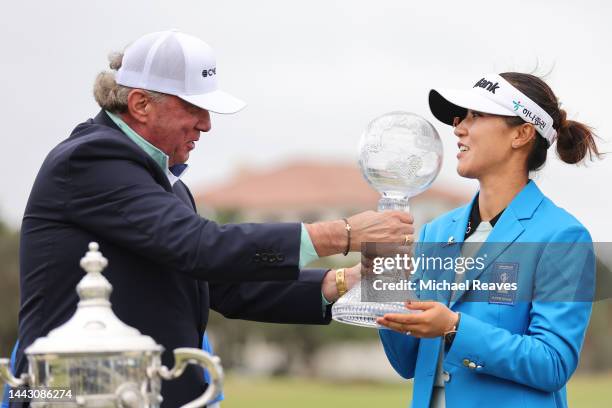 Of CME Group Terry Duffy presents Lydia Ko of New Zealand with the winner's check during the trophy presentation after the final round of the CME...