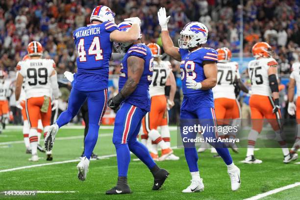 Matt Milano of the Buffalo Bills and Tyler Matakevich of the Buffalo Bills celebrate with DaQuan Jones of the Buffalo Bills after a blocked field...