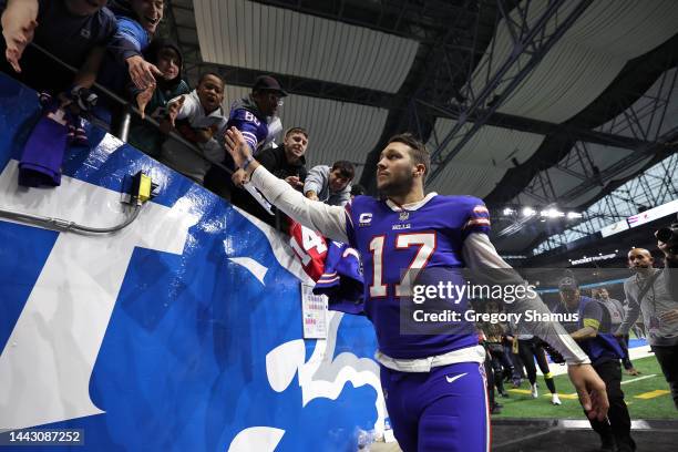 Josh Allen of the Buffalo Bills high fives fans after his team's 31-23 win against the Cleveland Browns at Ford Field on November 20, 2022 in...