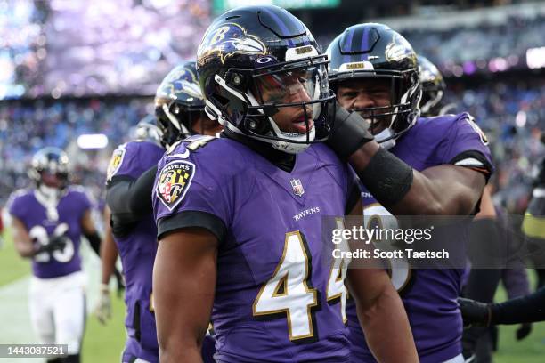 Marlon Humphrey of the Baltimore Ravens celebrates with teammates after intercepting a pass in the fourth quarter of a game against the Carolina...