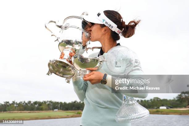 Lydia Ko of New Zealand poses for a photo with the Vare Trophy, the Rolex Player of the Year trophy and the CME Globe trophy after winning the CME...