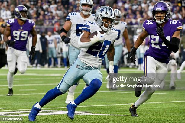 Tony Pollard of the Dallas Cowboys carries the ball against the Minnesota Vikings during the first half at U.S. Bank Stadium on November 20, 2022 in...