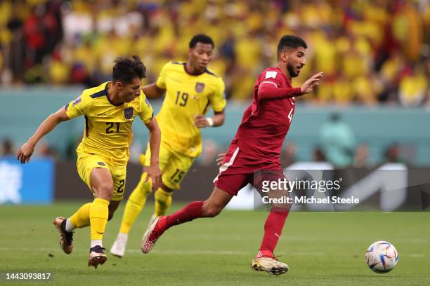 Mohammed Waad of Qatar tracked by Alan Franco of Ecuador during the FIFA World Cup Qatar 2022 Group A match between Qatar and Ecuador at Al Bayt...