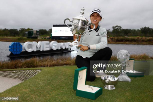 Lydia Ko of New Zealand poses for a photo with the Vare Trophy, the Rolex Player of the Year trophy and the CME Globe trophy after winning the CME...