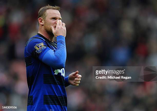 Wayne Rooney of Manchester United looks dejected after the Barclays Premier League match between Sunderland and Manchester United at the Stadium of...