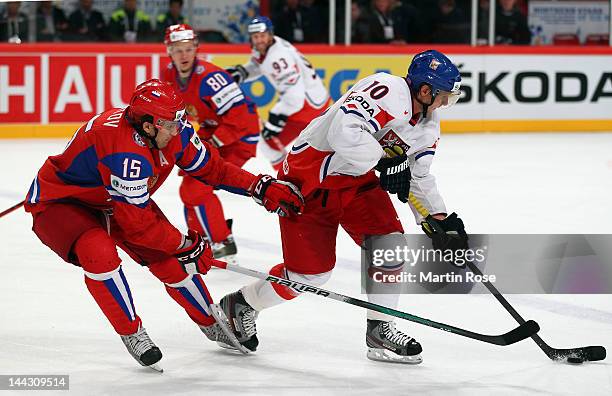 Alexander Svitov of Russia and Martin Erat of Czech Republic battle for the puck during the IIHF World Championship group S match between Russia and...