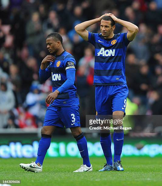 Patrice Evra and Rio Ferdinand of Manchester United look dejected after the Barclays Premier League match between Sunderland and Manchester United at...