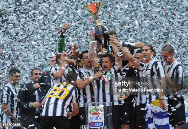 Alessandro Del Piero of Juventus FC lifts the Serie A trophy in his last match for the club as he celebrates winning the championship with team-mates...