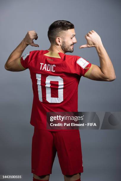 Dusan Tadic of Serbia poses during the official FIFA World Cup Qatar 2022 portrait session on November 20, 2022 in Doha, Qatar.