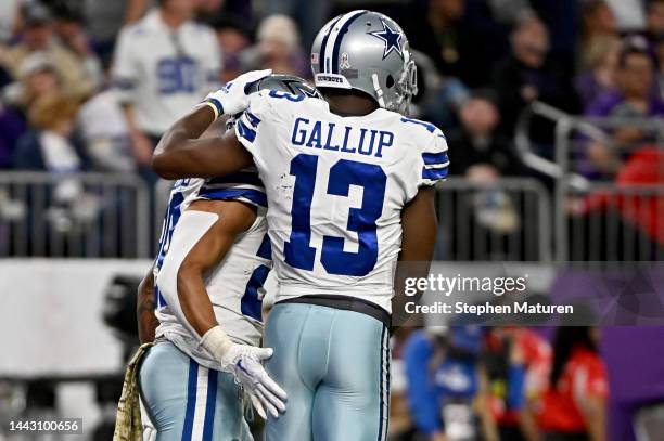 Tony Pollard of the Dallas Cowboys and Michael Gallup of the Dallas Cowboys celebrate on the field during the first half against the Minnesota...