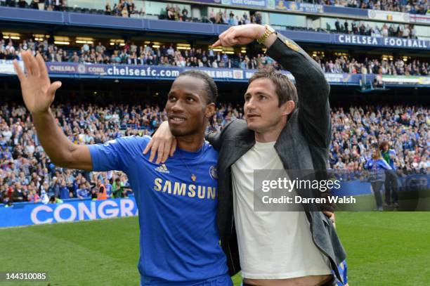 Didier Drogba and Frank Lampard of Chelsea applaud the fans during the Barclays Premier League match between Chelsea and Blackburn Rovers at Stamford...