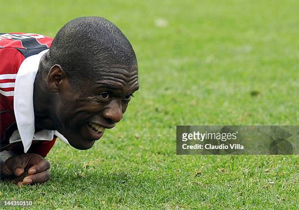 Clarence Seedorf of AC Milan reacts as he lies on the turf after the Serie A match between AC Milan and Novara Calcio at Stadio Giuseppe Meazza on...